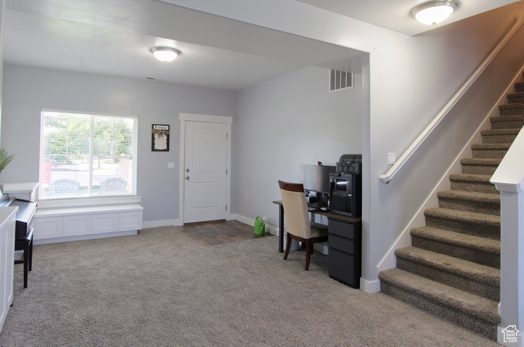 Office with carpet flooring and baseboards