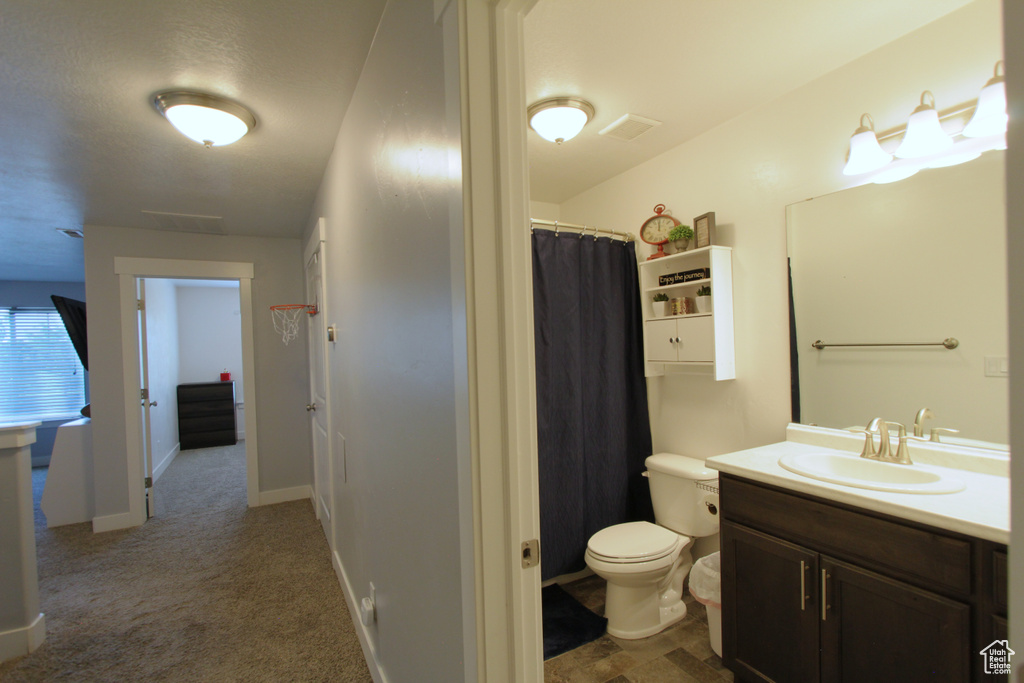 Full bath featuring vanity and a shower with shower curtain