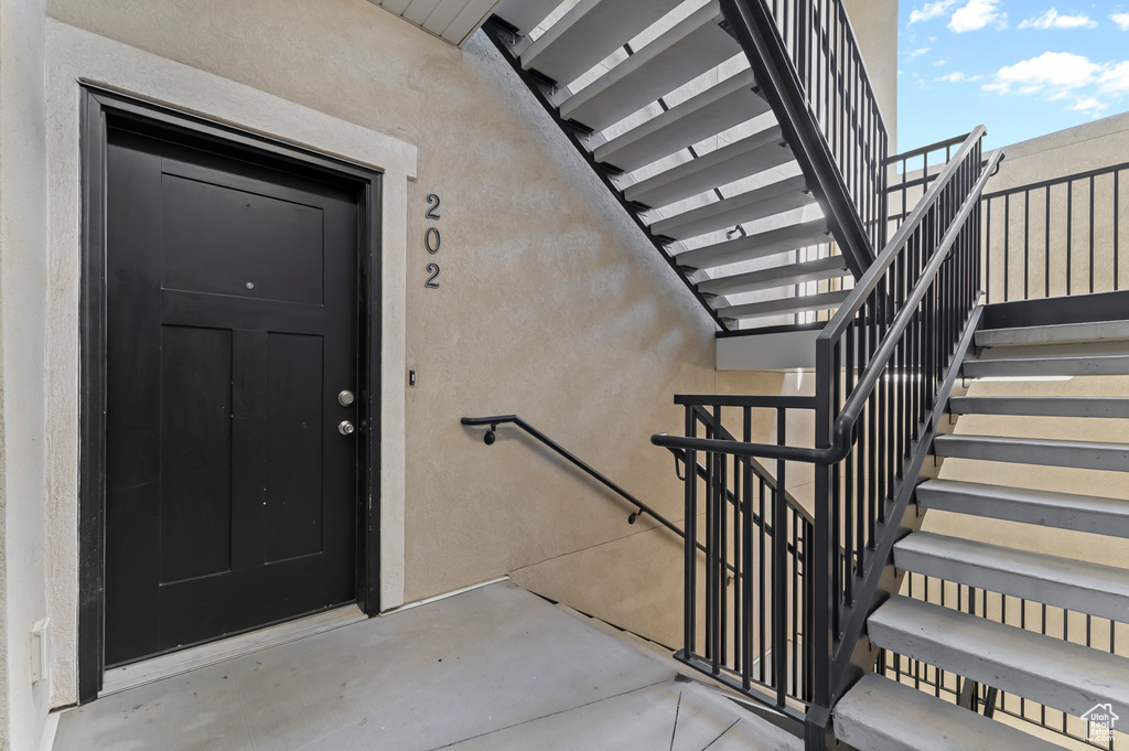 Entrance to property featuring stucco siding