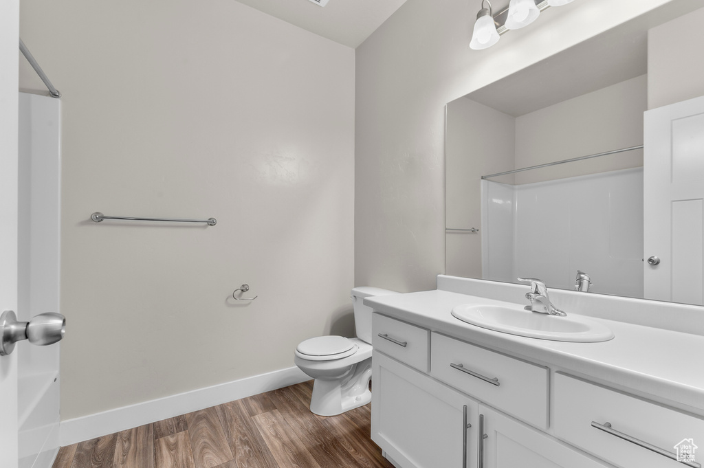 Bathroom featuring vanity and wood finished floors