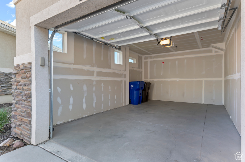 Garage featuring a garage door opener