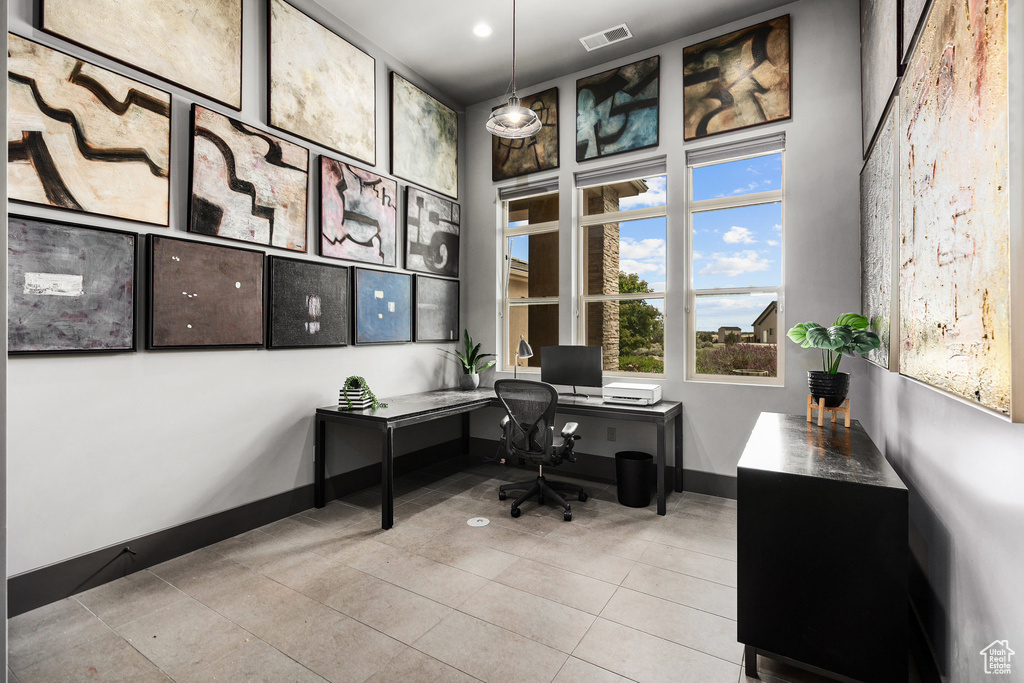 Office area with tile patterned floors and recessed lighting