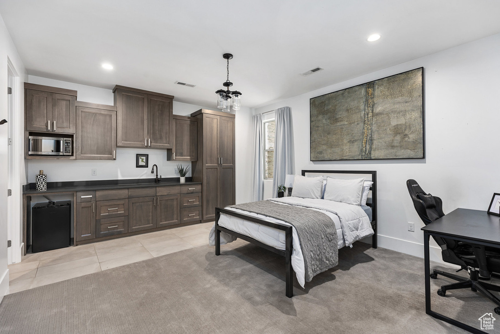 Bedroom featuring an office area, recessed lighting, and light tile patterned floors