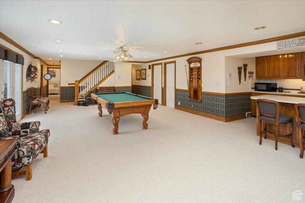 Game room featuring crown molding, recessed lighting, pool table, wainscoting, and light carpet