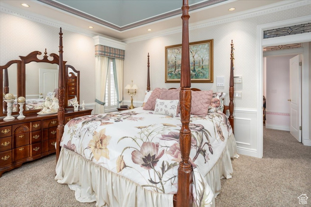 Bedroom featuring carpet, ornamental molding, wallpapered walls, a wainscoted wall, and recessed lighting