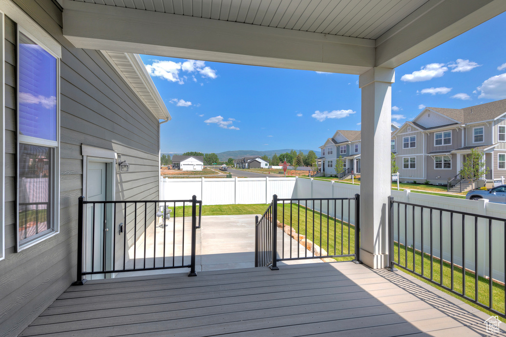 Wooden deck with a residential view