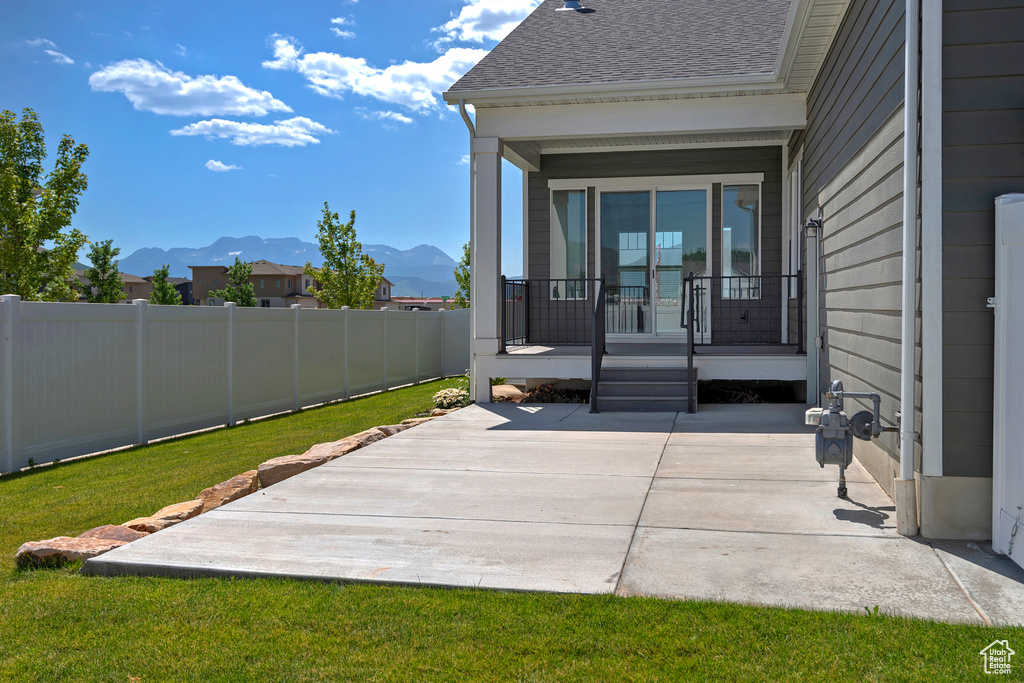 Covered porch with a mountain view