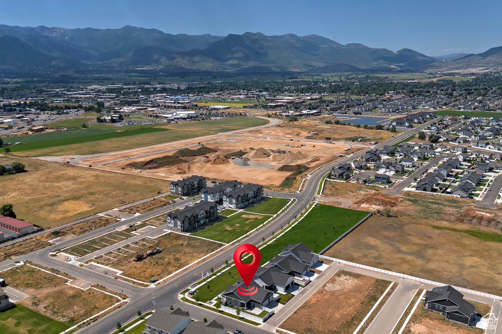 View of property location with mountains and nearby suburban area
