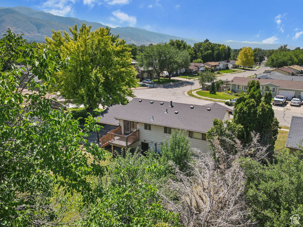 Aerial perspective of suburban area featuring a mountainous background
