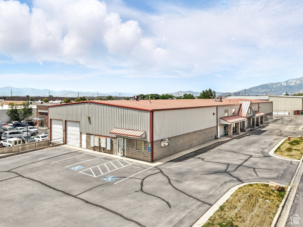 View of property with a mountain view