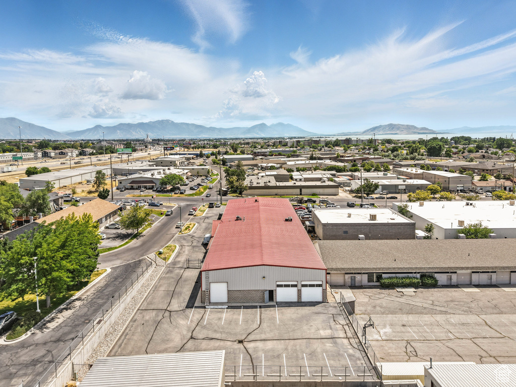 Aerial view of residential area featuring a mountainous background