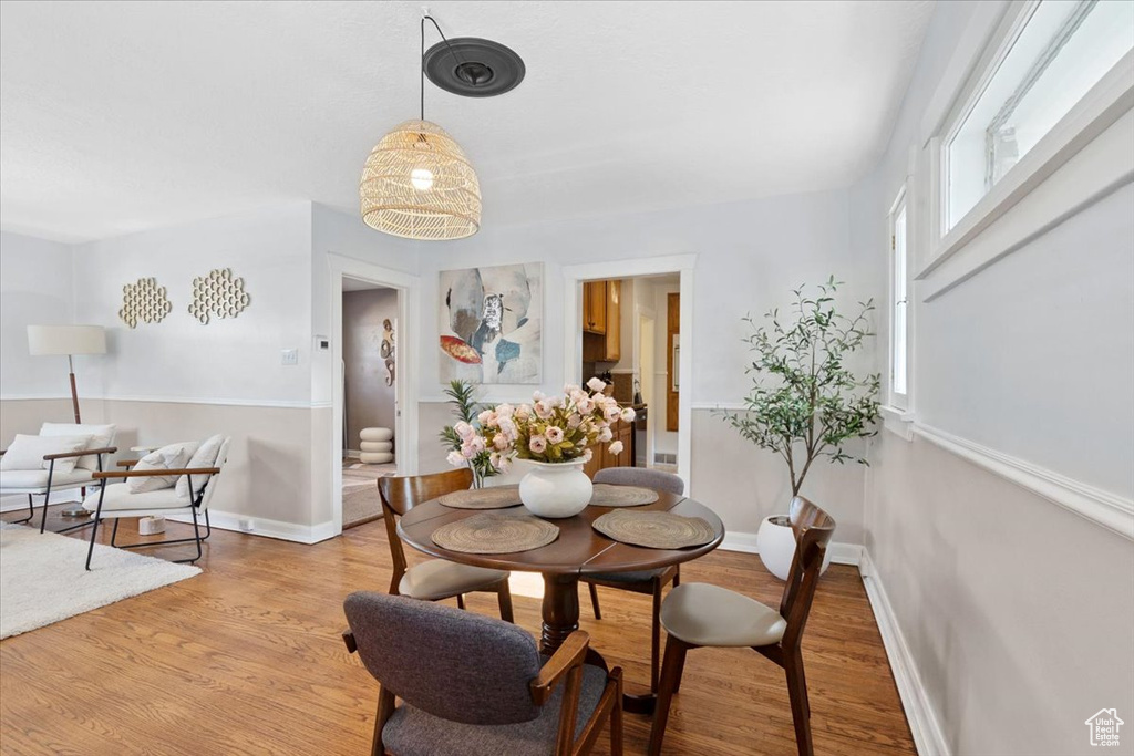 Dining area with light wood finished floors