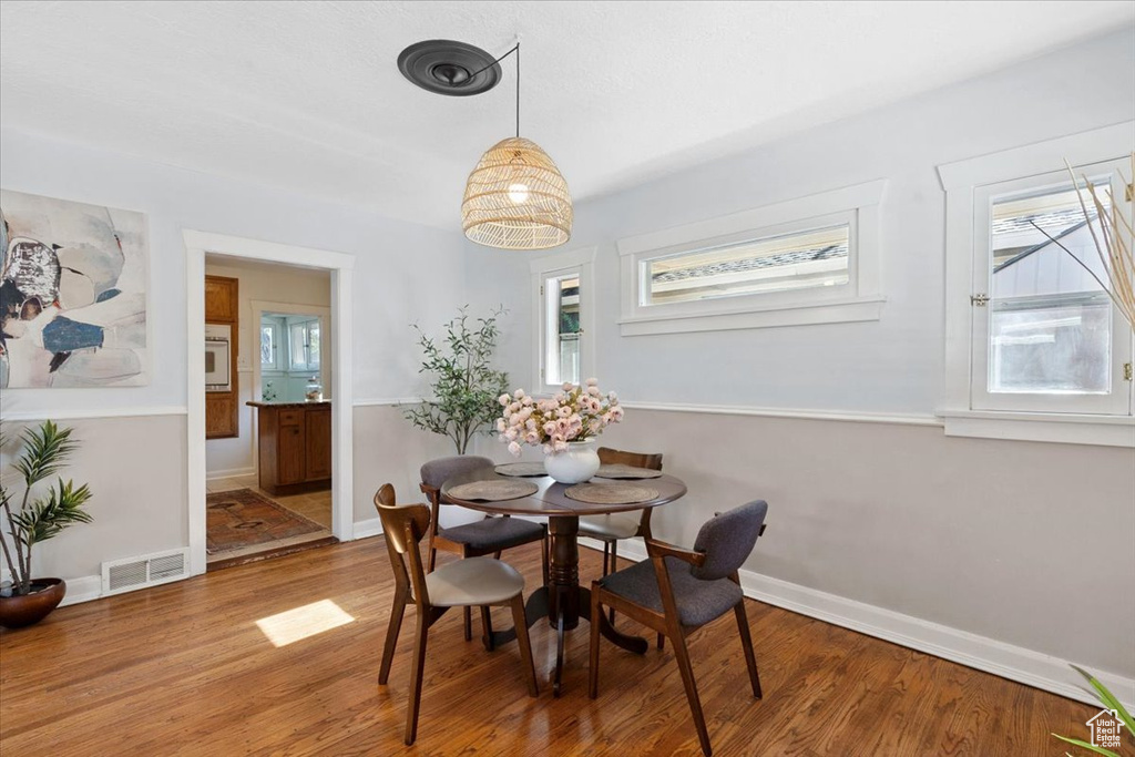 Dining room featuring light wood-style floors and baseboards