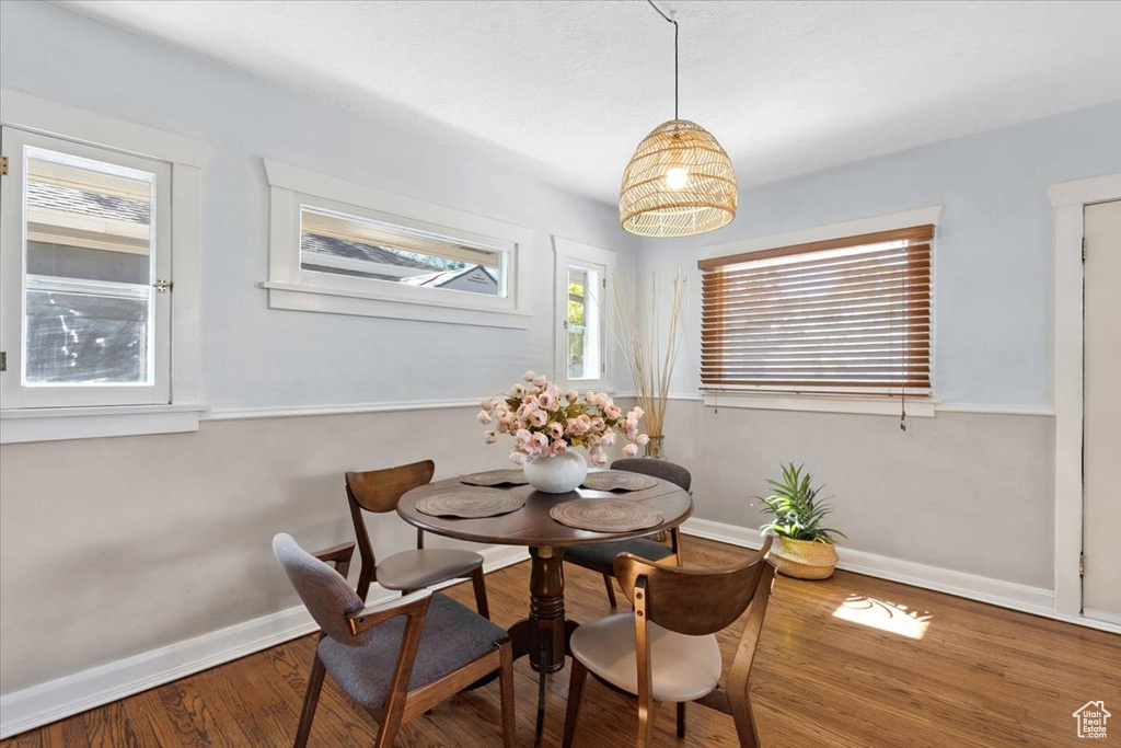 Dining space featuring wood finished floors and baseboards