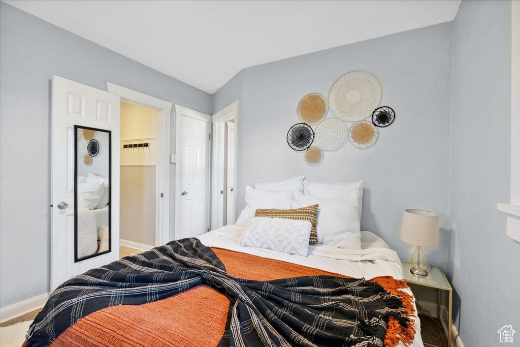 Carpeted bedroom with baseboards