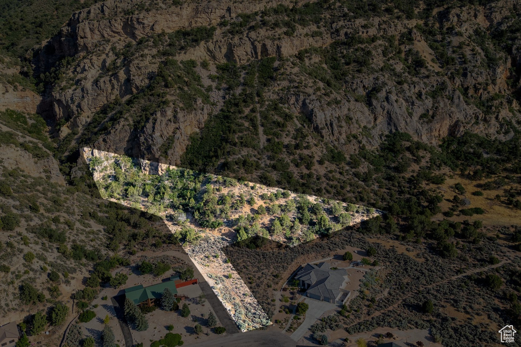 Aerial view of property and surrounding area featuring a desert landscape