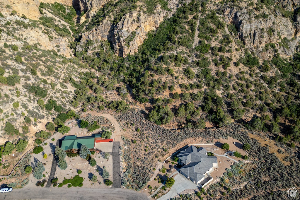 Aerial view of property and surrounding area featuring rural landscape and a desert landscape