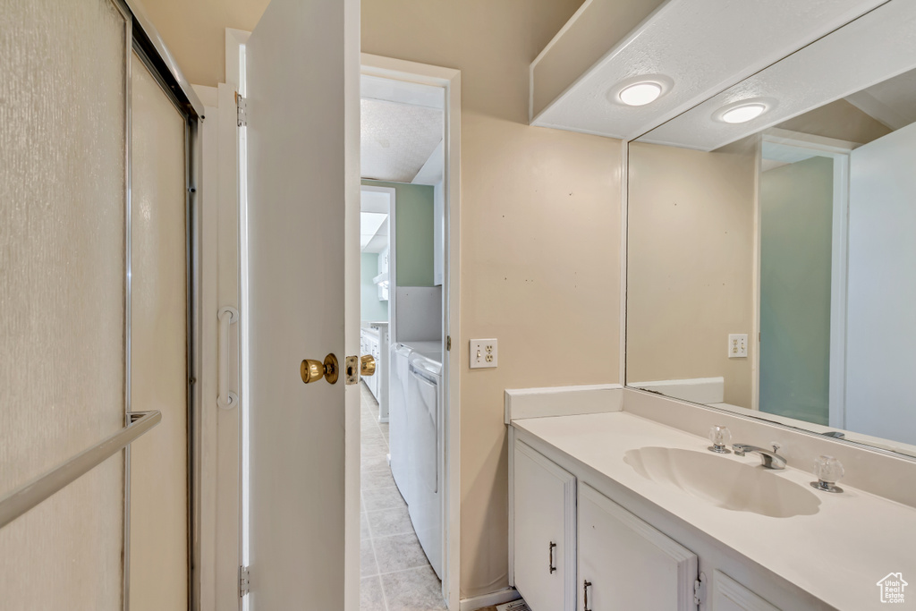 Bathroom featuring vanity and tile patterned flooring