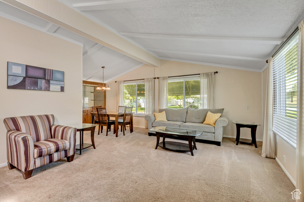 Living area with a chandelier and carpet