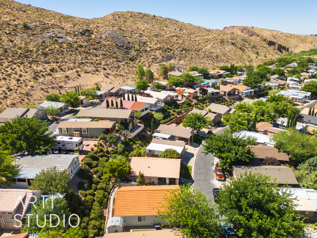 Aerial view of residential area featuring a mountainous background