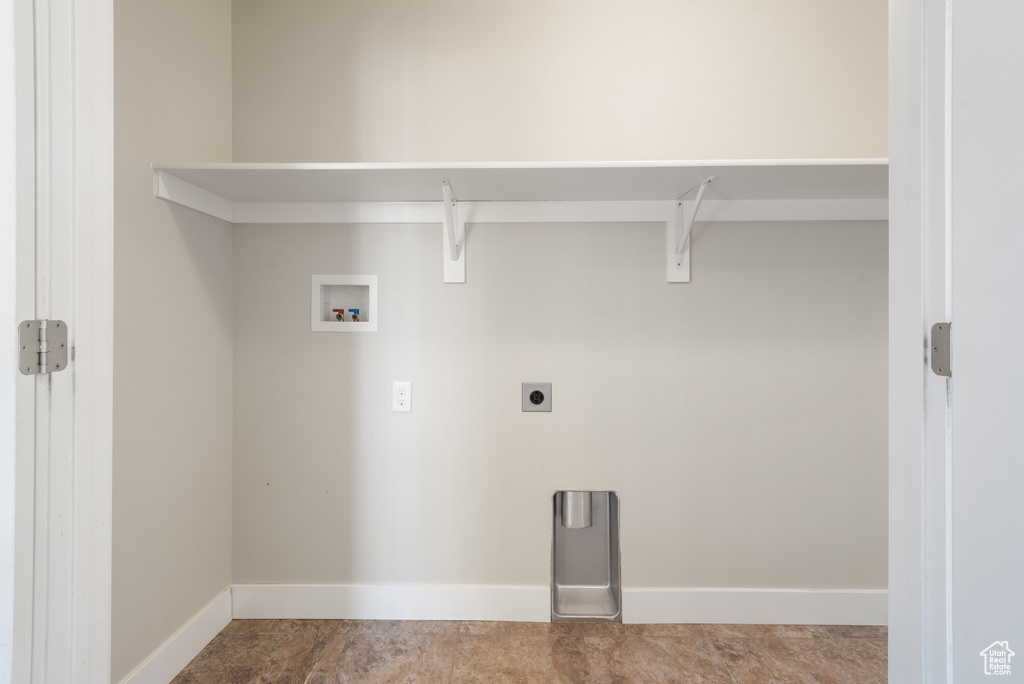 Laundry area featuring hookup for a washing machine and hookup for an electric dryer