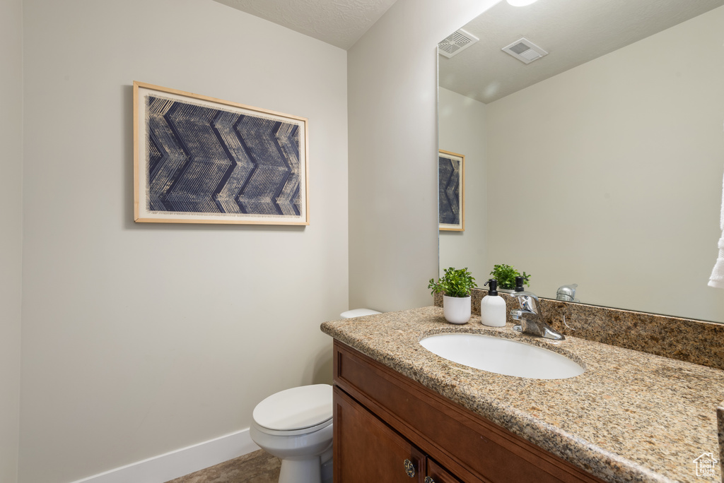 Bathroom with vanity and toilet