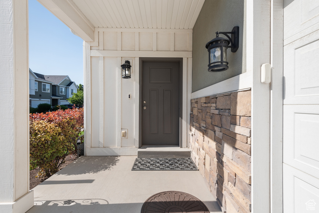 View of exterior entry with board and batten siding
