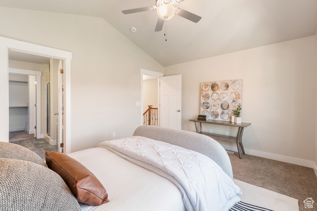 Bedroom featuring vaulted ceiling, carpet, and ceiling fan