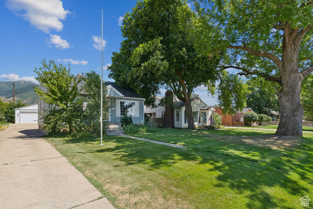 View of front of house with a detached garage