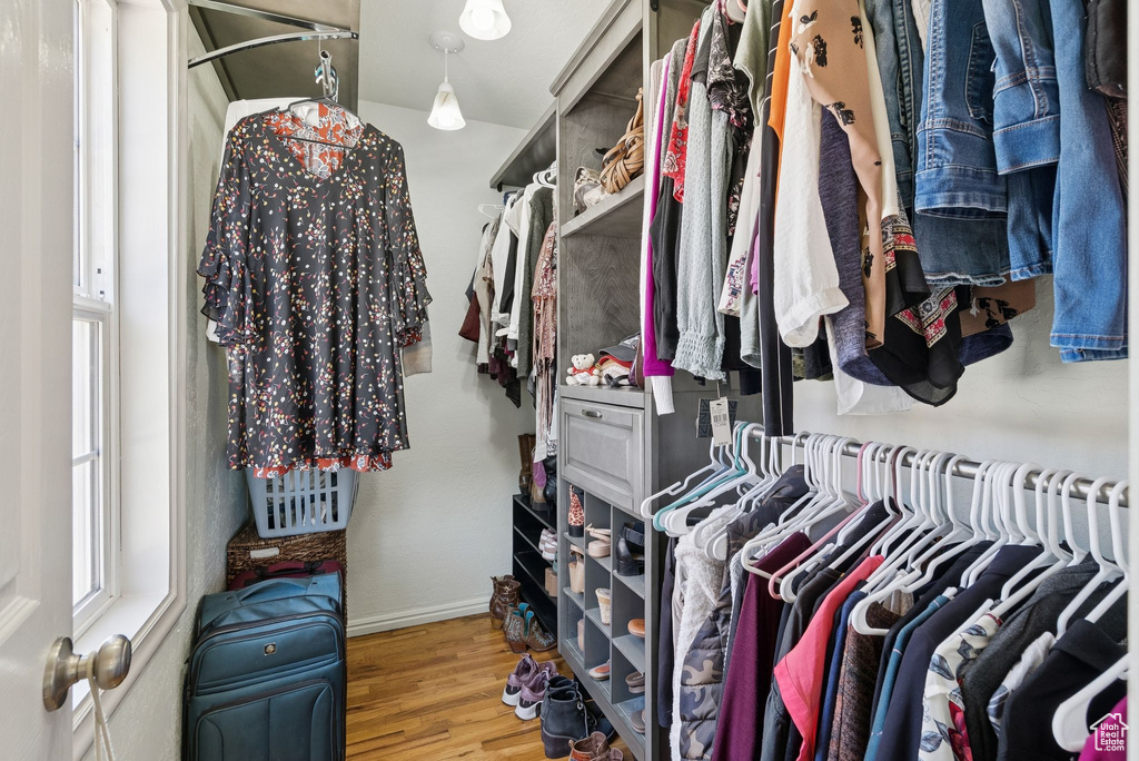 Walk in closet featuring wood finished floors