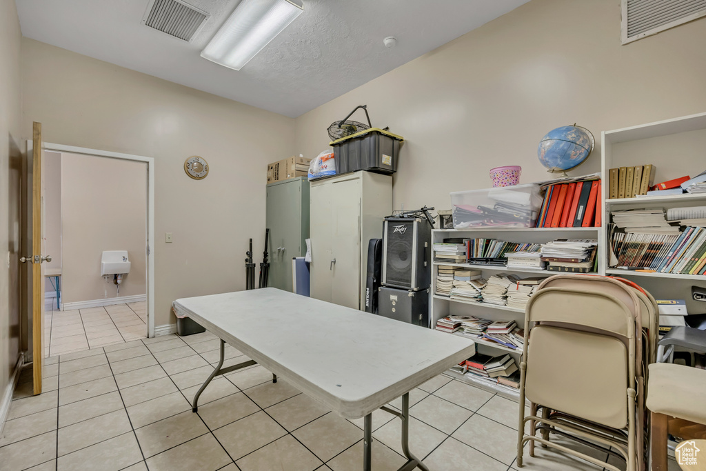 Office with tile patterned floors