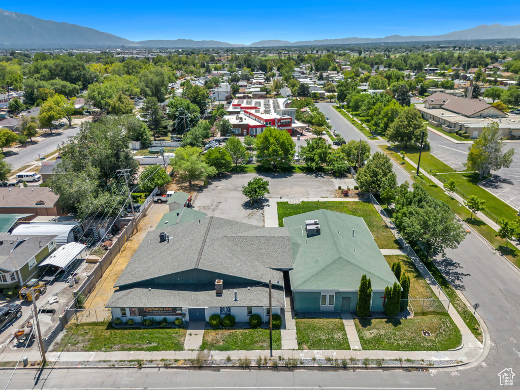 Aerial perspective of suburban area with a mountain backdrop