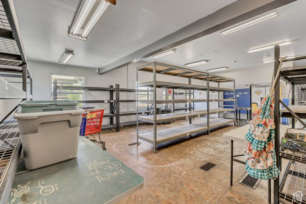 Misc room featuring concrete block wall