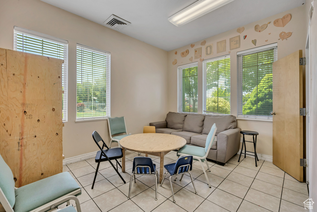 Living area featuring light tile patterned floors