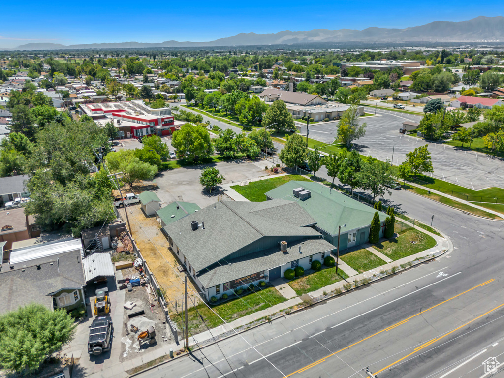 Aerial perspective of suburban area featuring a mountain backdrop