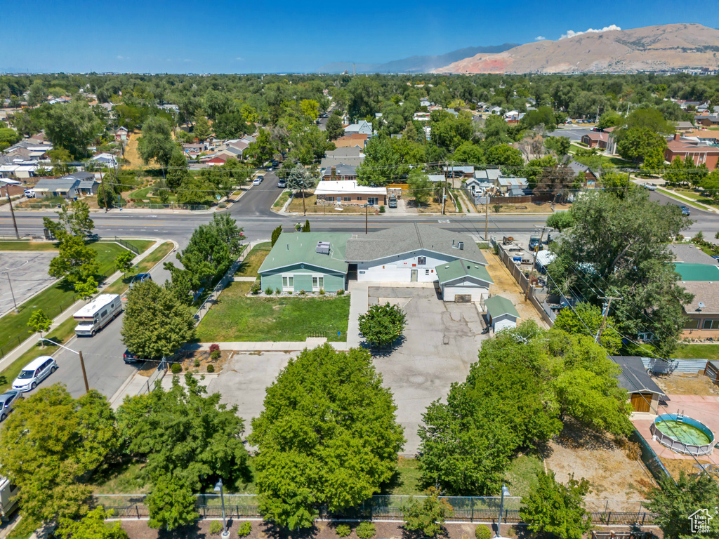 Aerial view of residential area featuring a mountain backdrop