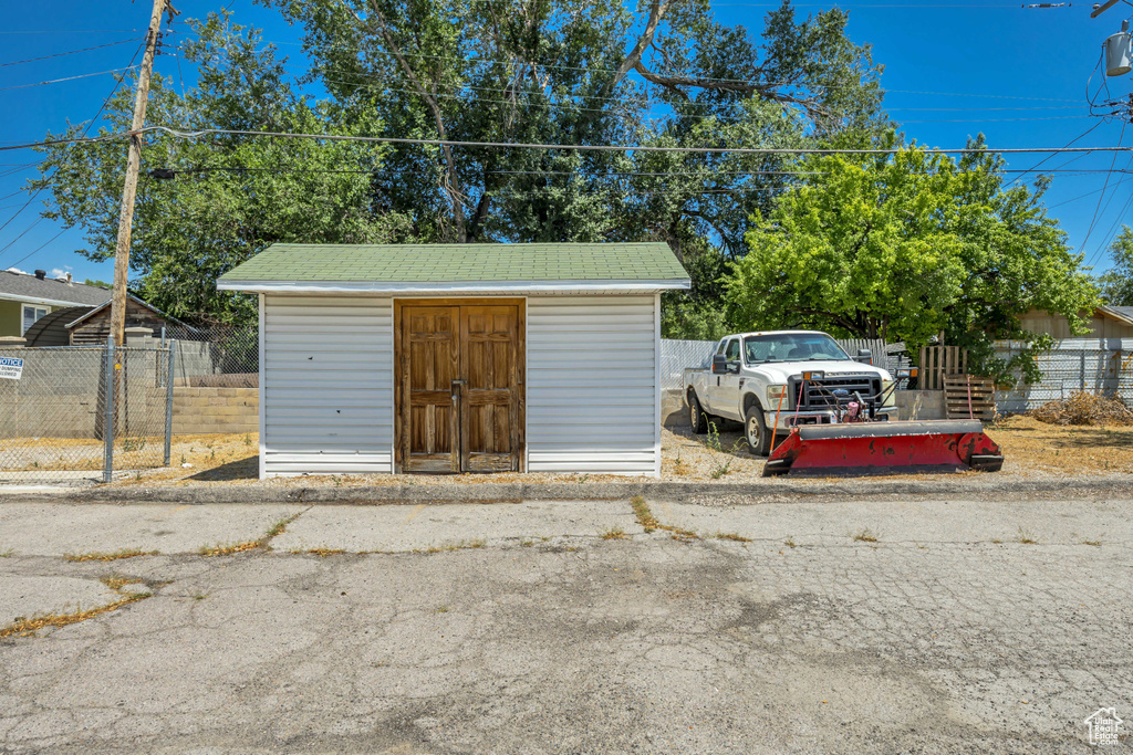 Garage featuring a storage shed