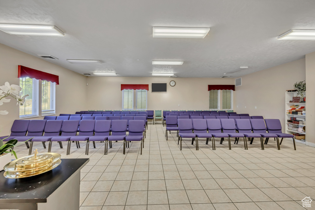 Misc room with light tile patterned floors