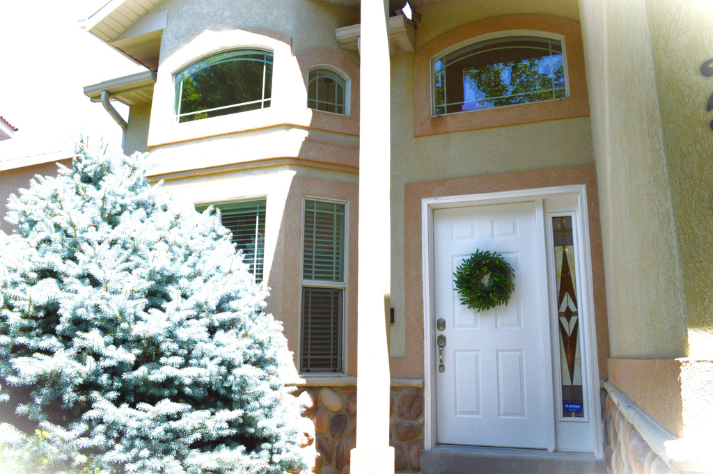 Property entrance with stucco siding