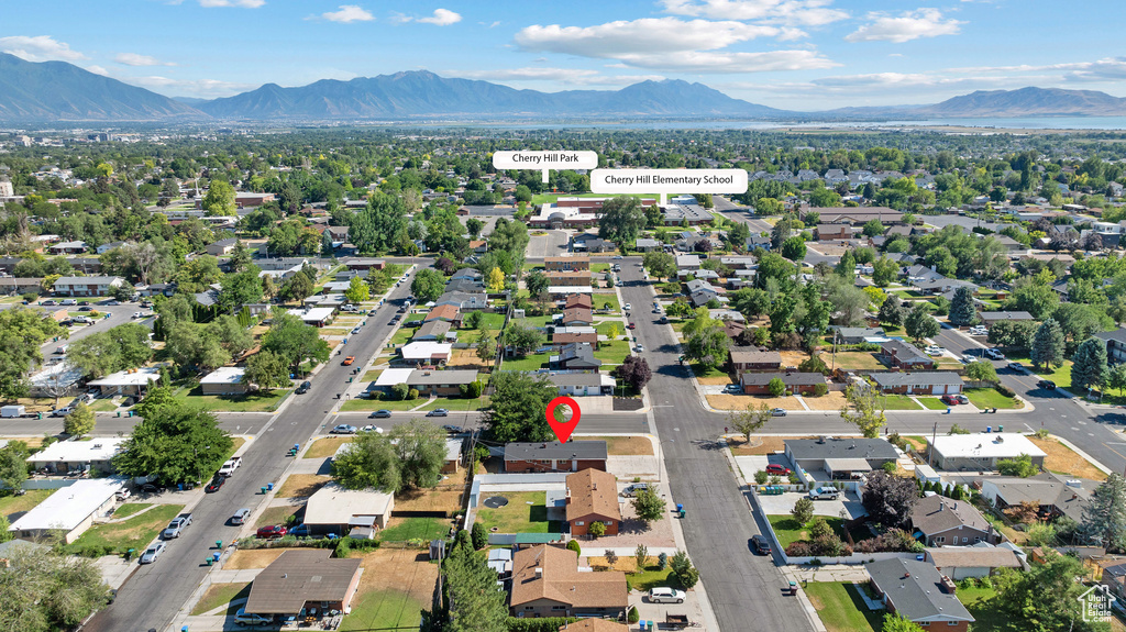 View of property location with a mountain backdrop and nearby suburban area