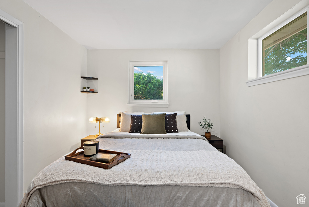 Bedroom with multiple windows