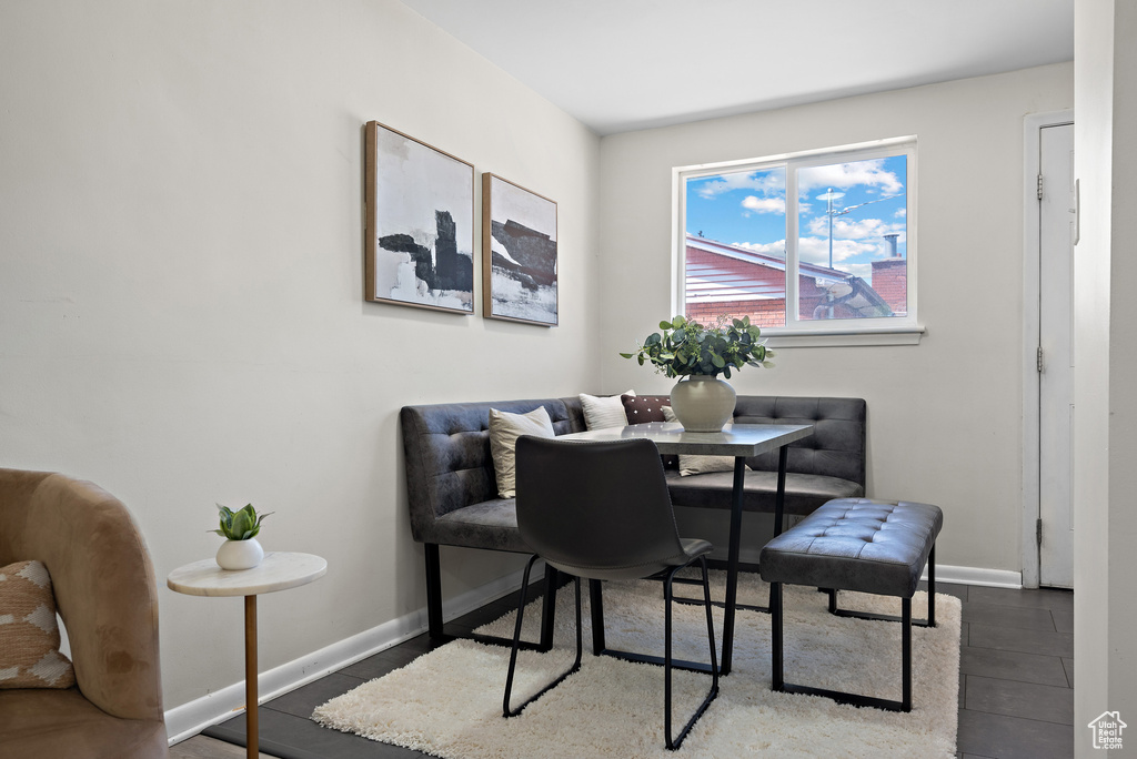 Dining area featuring baseboards and wood finished floors