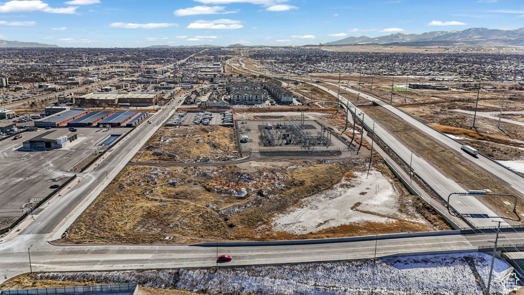 Aerial view of a major roadway and a mountain backdrop