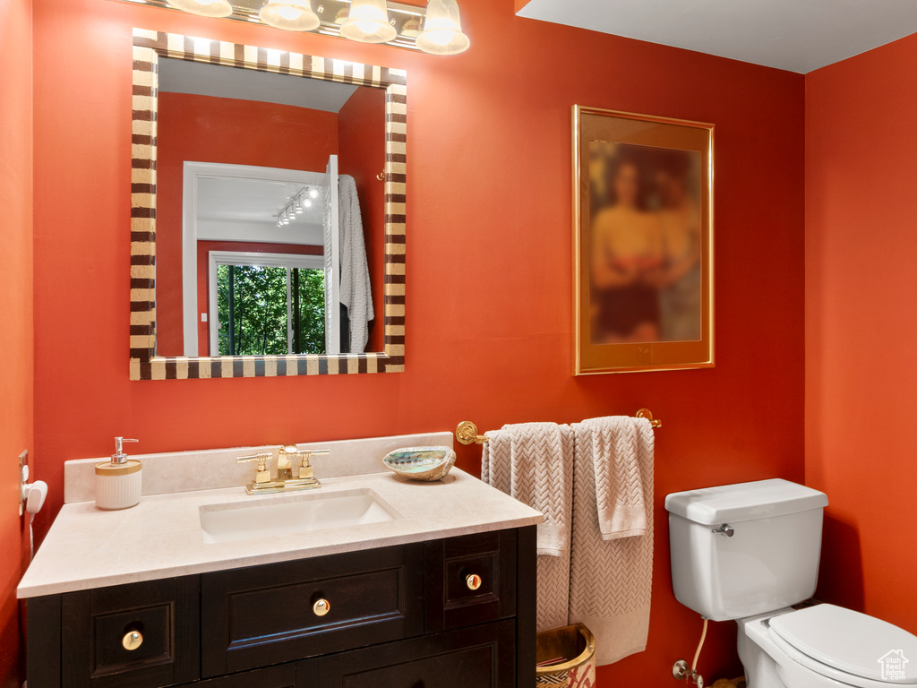 Bathroom with toilet and vanity