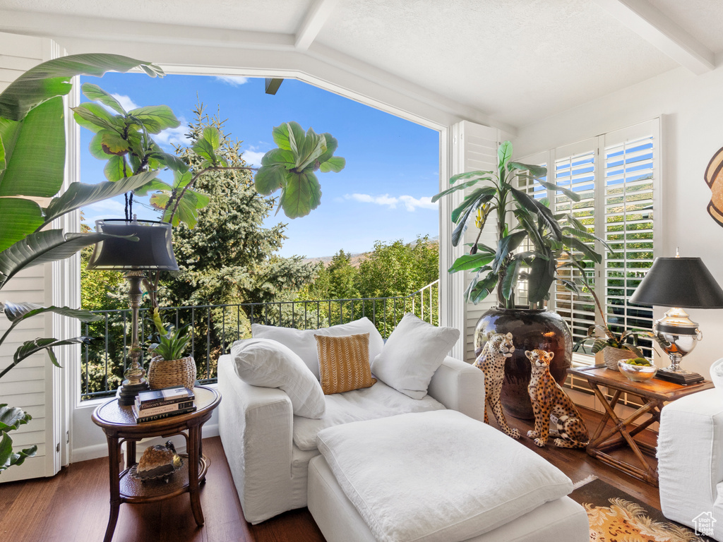 Sunroom / solarium featuring beamed ceiling