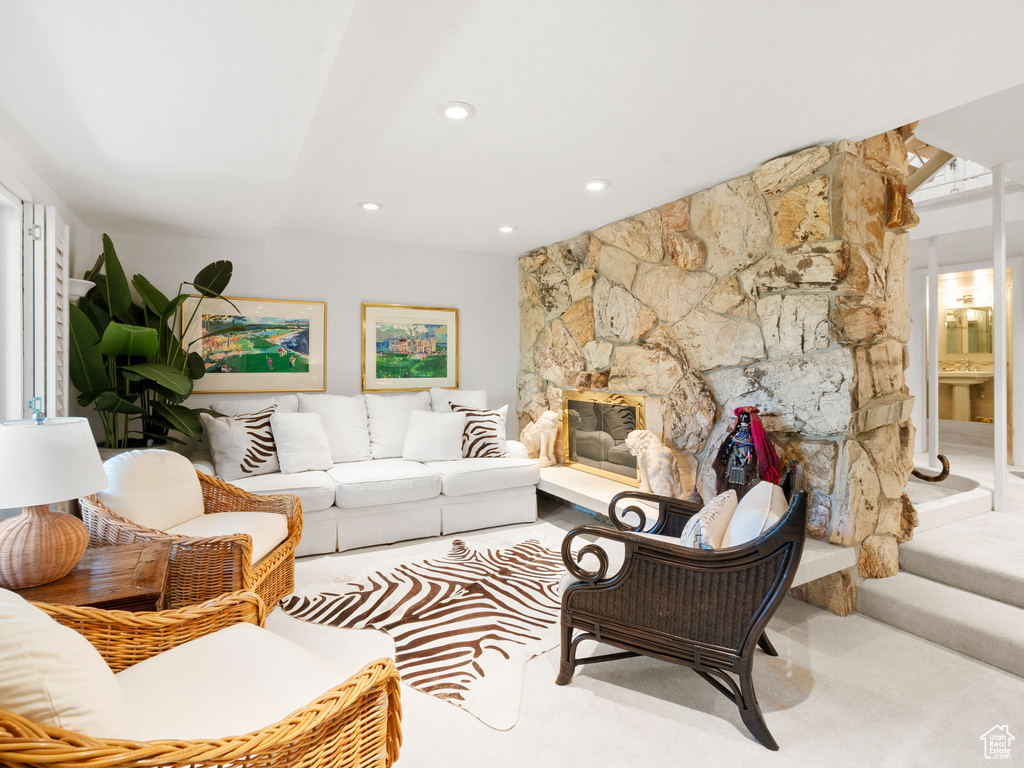 Living room with recessed lighting and a fireplace
