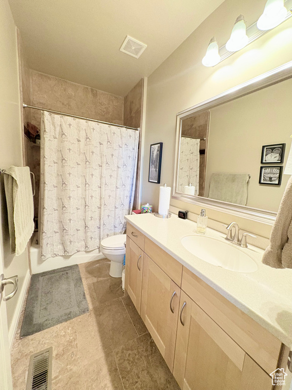 Full bath featuring vanity and shower / bathtub combination with curtain