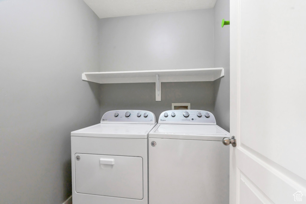 Laundry room featuring washing machine and dryer
