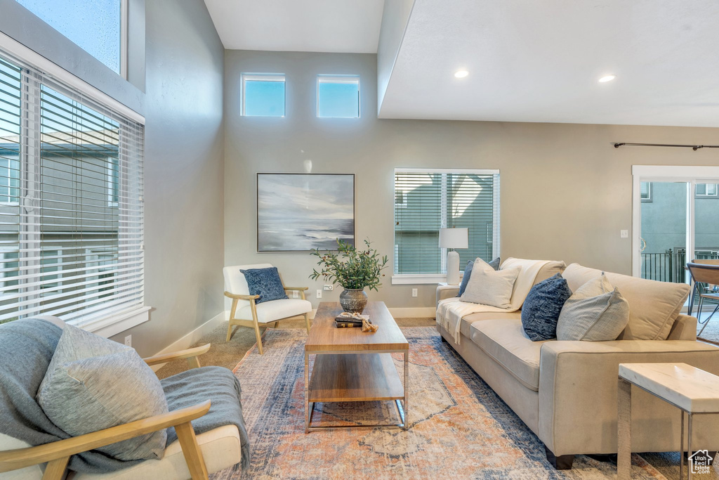 Living area featuring baseboards and recessed lighting