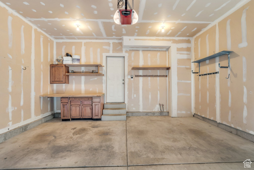 Garage featuring a garage door opener